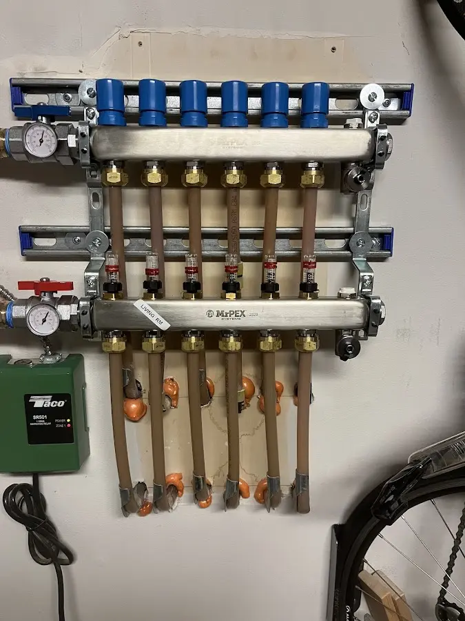 Plumber performing Water Heater Repair at a residential property in Alexandria